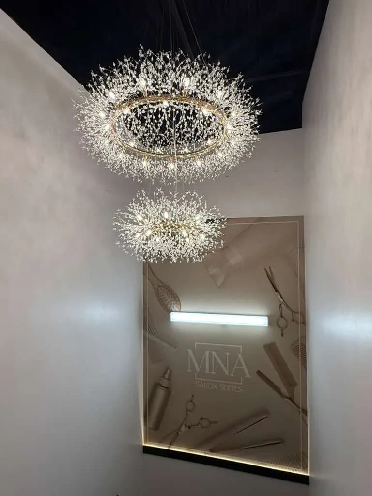 The client lounge chandelier above the MNA marble wall